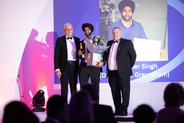 Raspinder, centre, wins award with Kevin Lewis on left and David Glover. Photo: Caremark Ltd